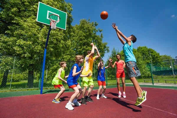 depositphotos_88608500-stock-photo-teenagers-playing-basketball-game-together